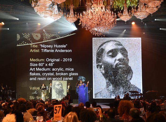 Wearable Art Gala stage with artwork of Nippsey Hussle by Tiffanie Anderson